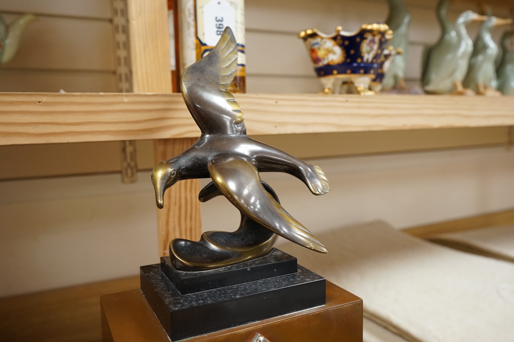 An French Art Deco copper and chrome mantel clock, with bronze seagull surmount, 57cm high